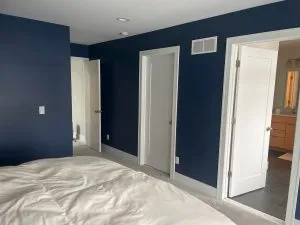 Navy blue painted bedroom and hallway in Michigan home