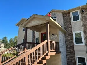 Exterior deck and siding painting on Michigan apartment complex