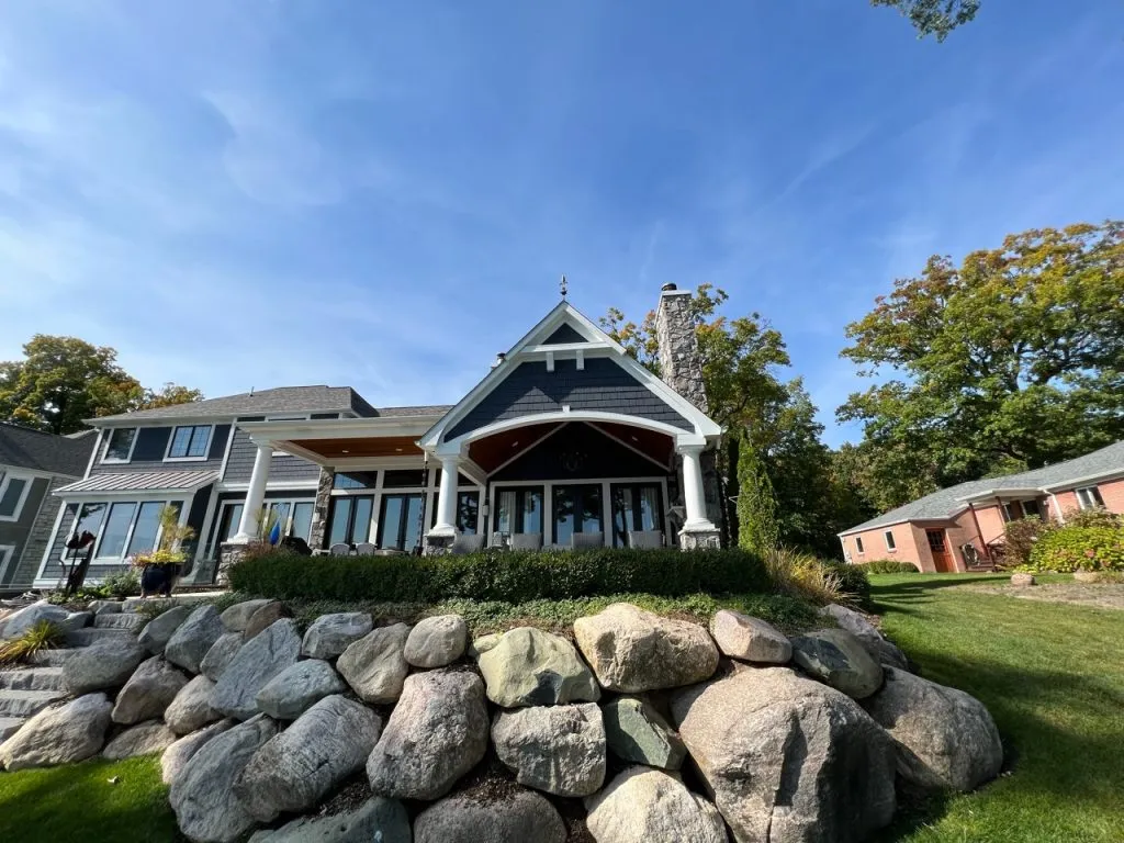 Dark exterior paint finish on Michigan home with stone accents