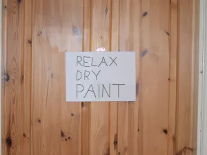 Relax dry paint sign on wood wall in Michigan
