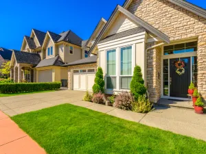Exterior painting of stone accent home in Michigan