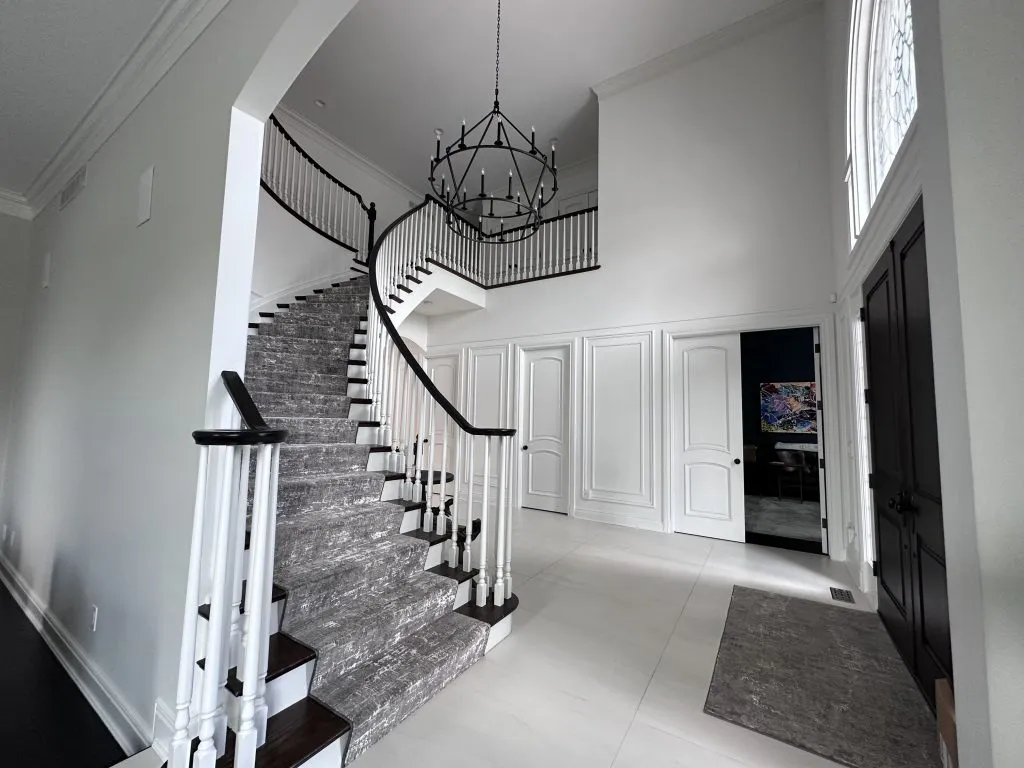Staircase and foyer painting with iron railing Michigan