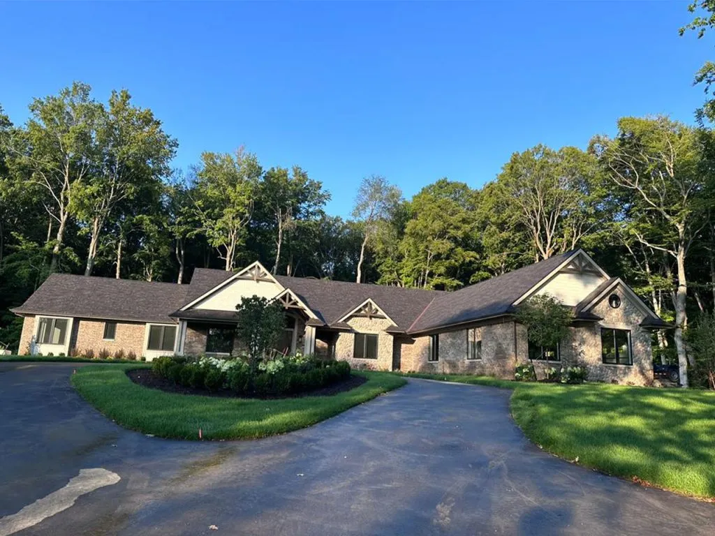 "Freshly painted tan and gray houses along quiet residential street"