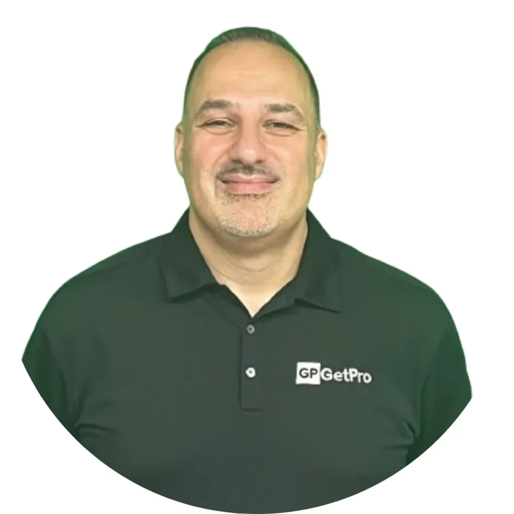 Mike, President of GetPro Painting, wearing a black polo shirt with the company logo, smiling against a white background.