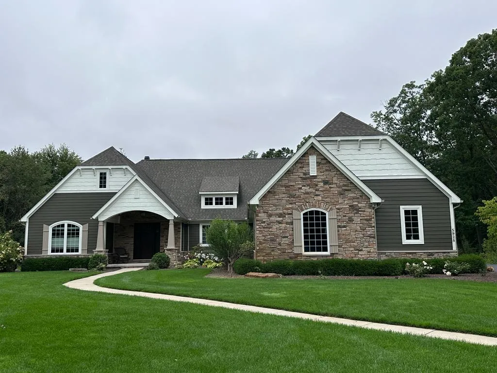 Exterior of a home showcasing fresh weather-resistant paint, highlighting effective painting techniques and outdoor aesthetics.